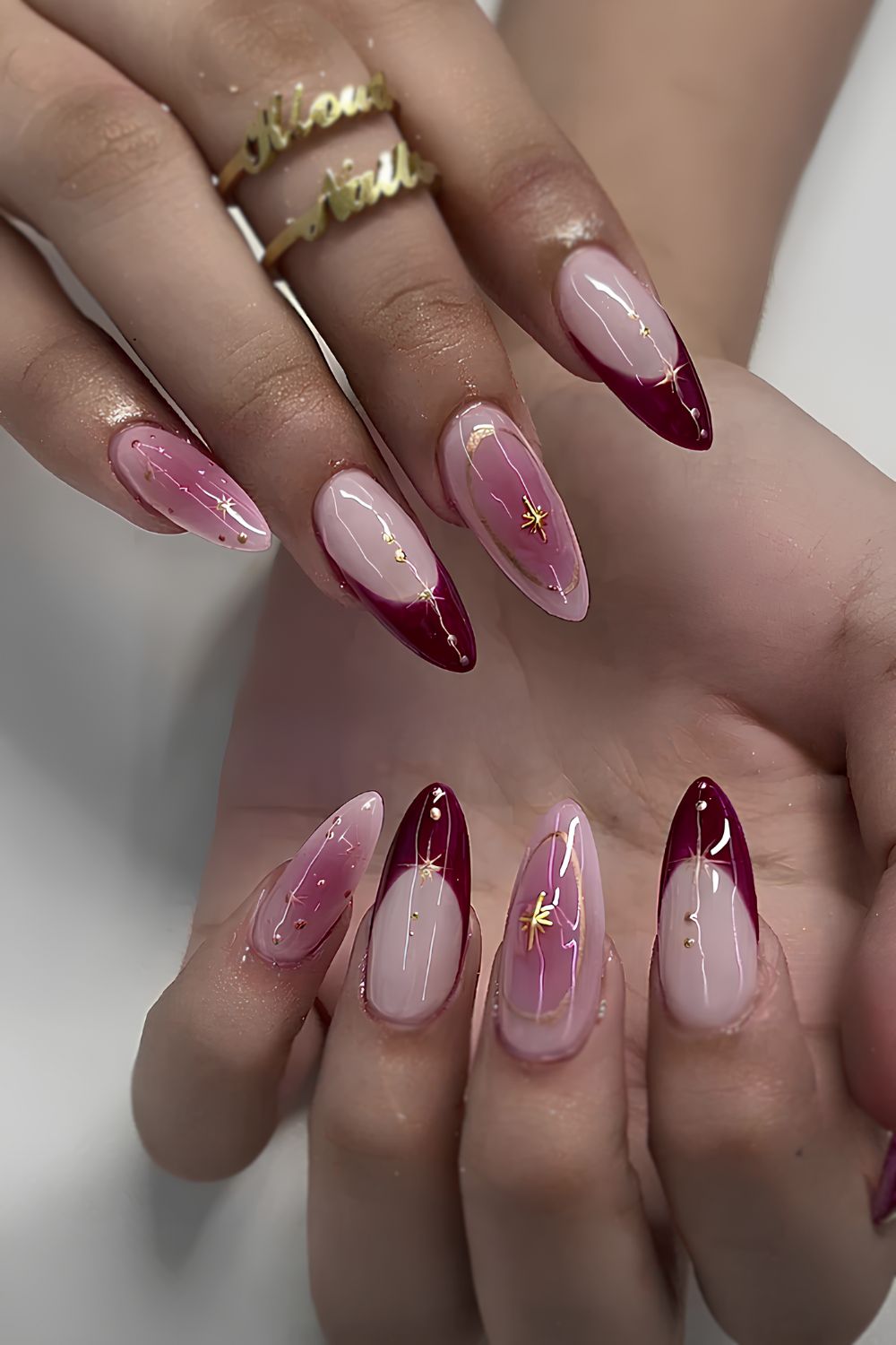 Red and pink mani with gold celestial accents