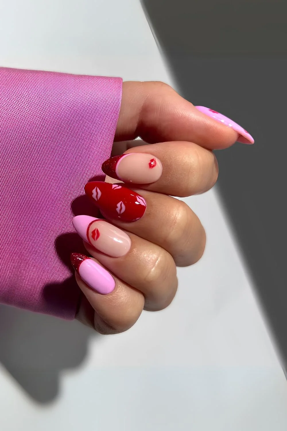 Red and pink mani with kisses design for valentines