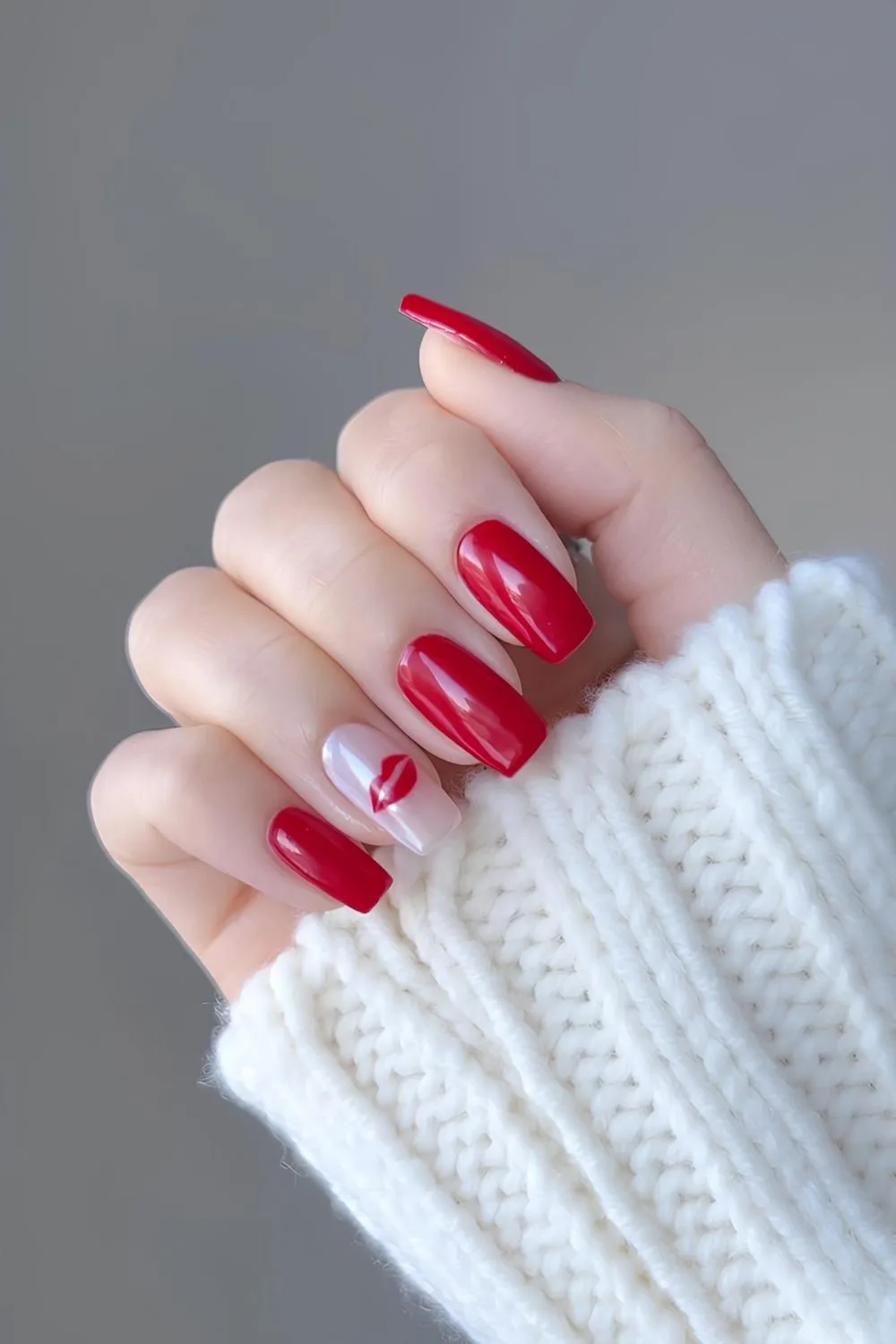 Red chrome nails with white chrome accent with red kiss detail