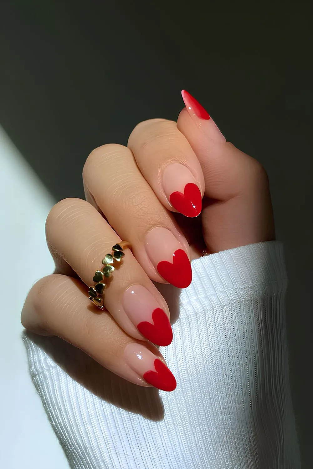 Red heart-shaped French tip nails