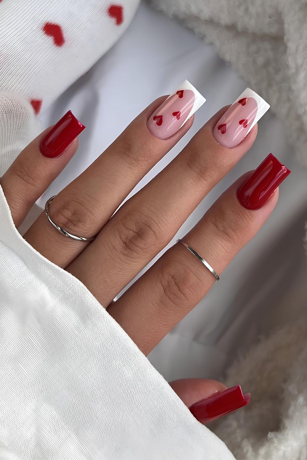 Red nails with white French tip accents