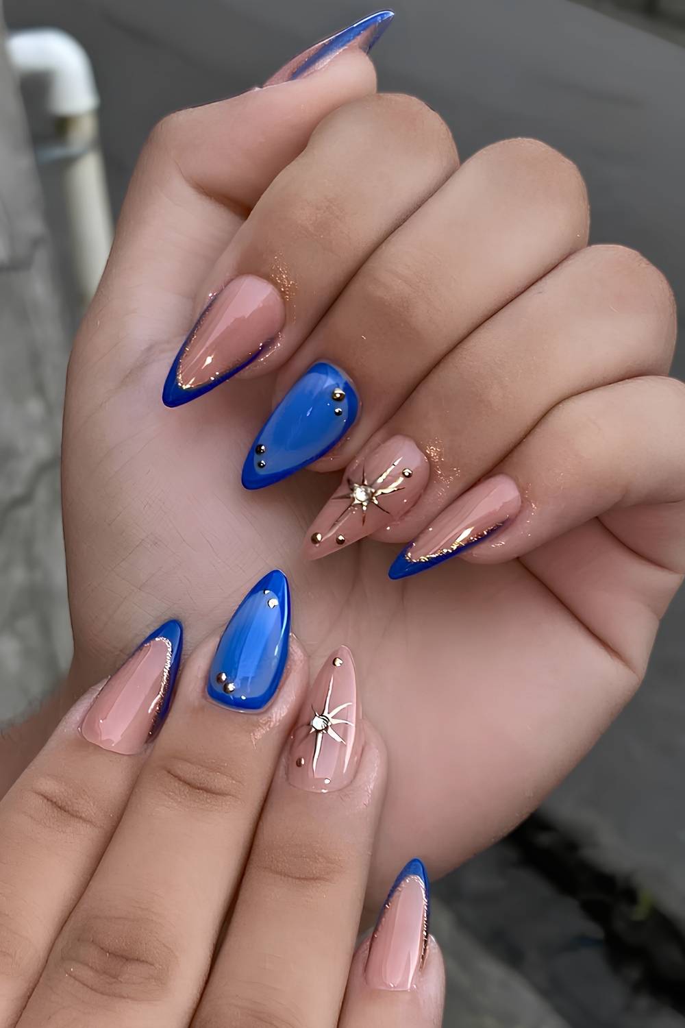Royal blue and gold celestial nails
