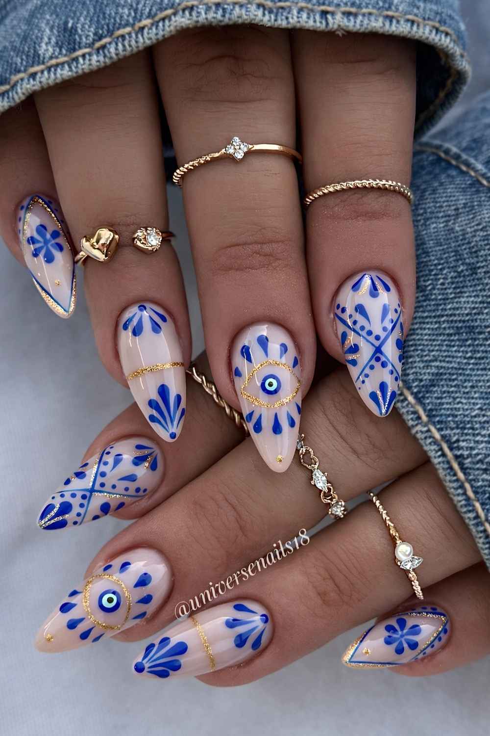 Royal blue and white evil eye nails