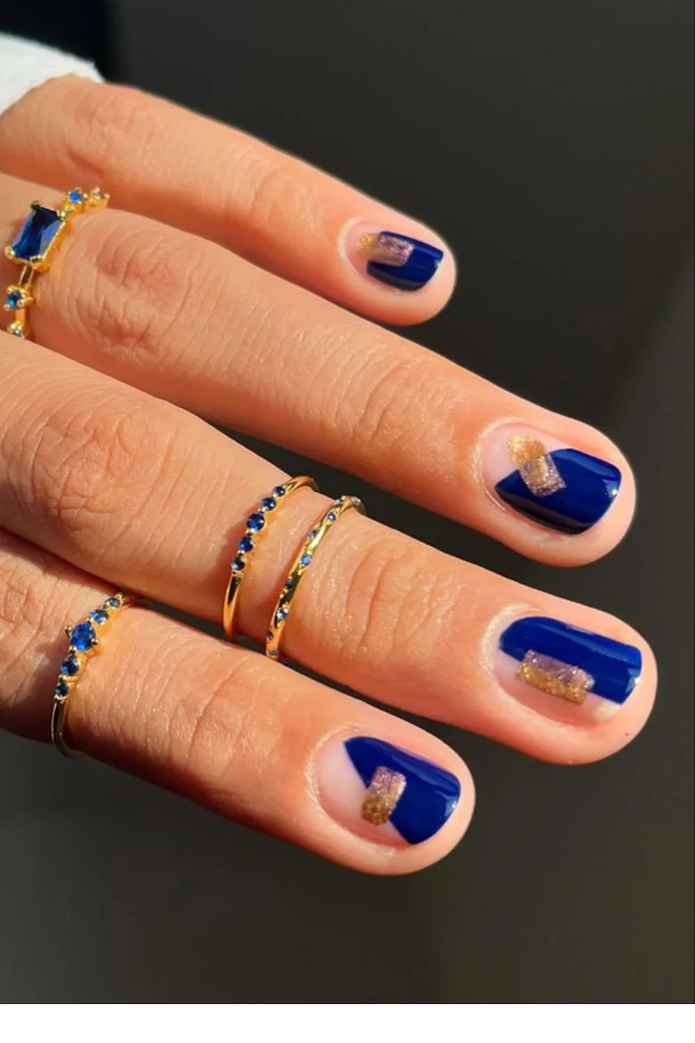 Royal blue geometric nails with gold blocks