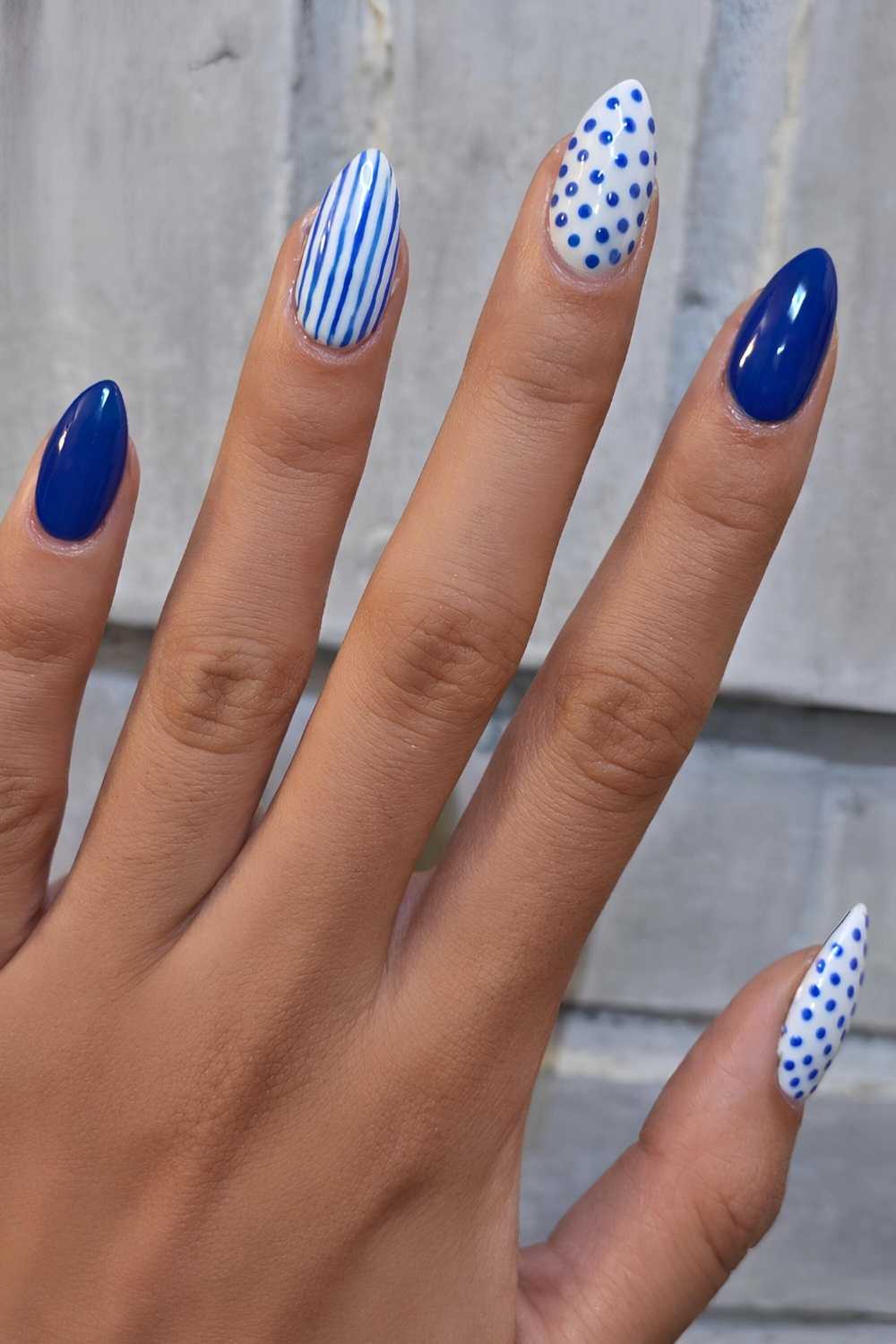 Royal blue mani with stripes and polka dots