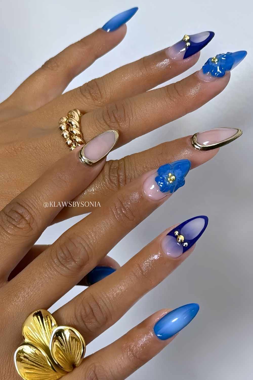 Royal blue nails with 3d flowers and gold details