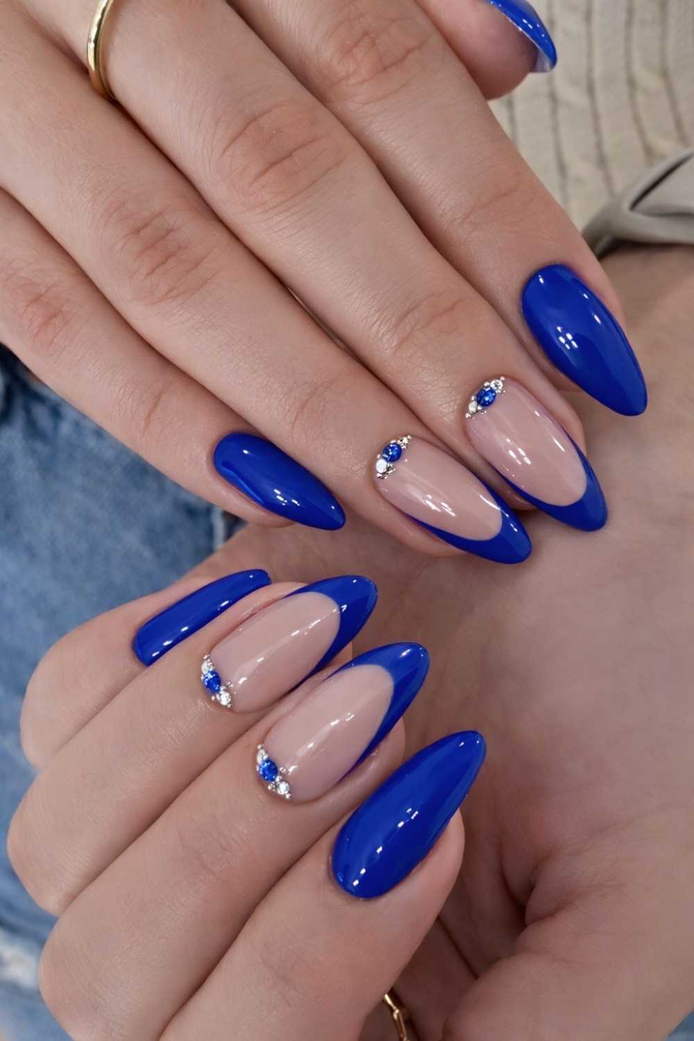 Royal blue nails with accent gems