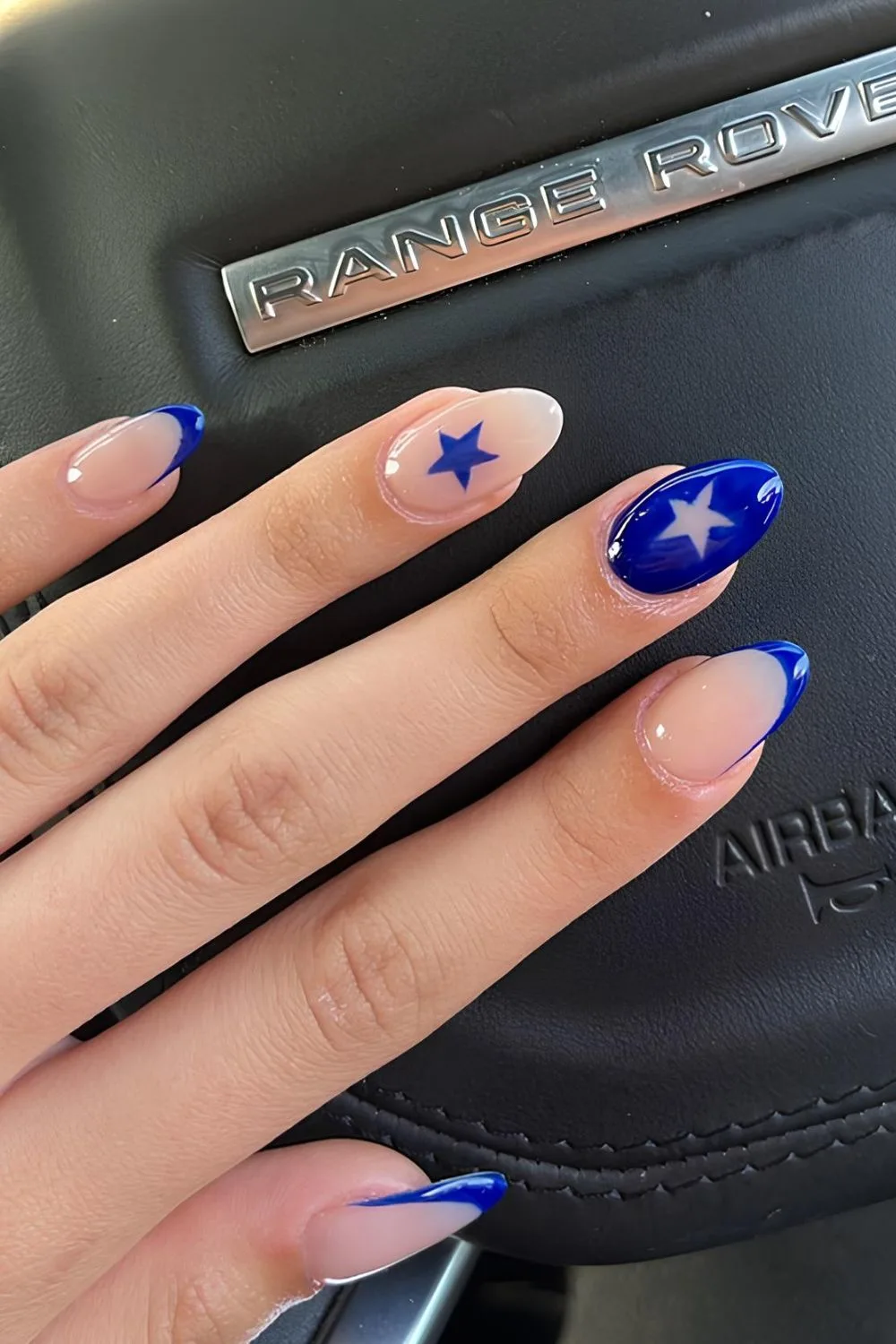 Royal blue nails with star accents