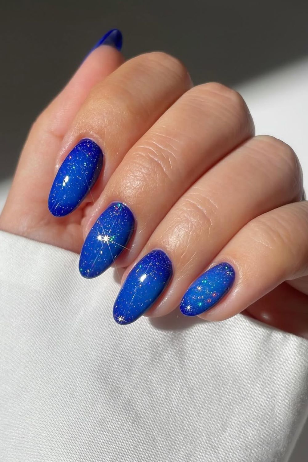 Royal blue sparkly aura nails