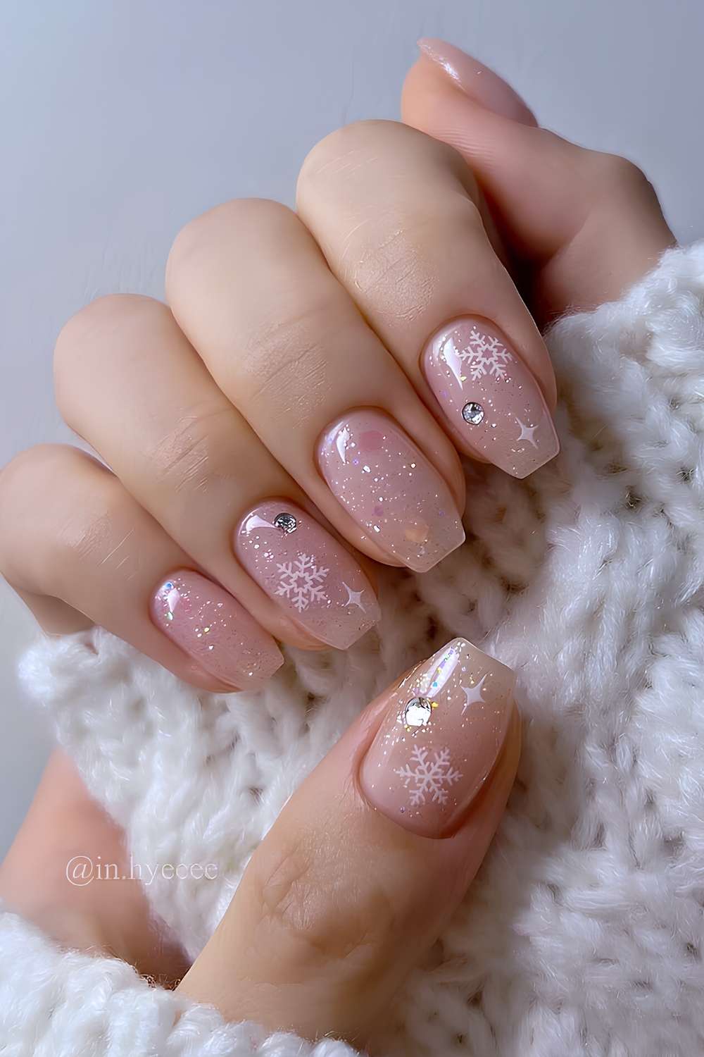 Sheer glitter nails with snowflakes and gems