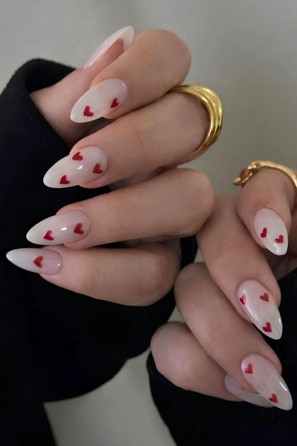 Sheer white nails with red heart art