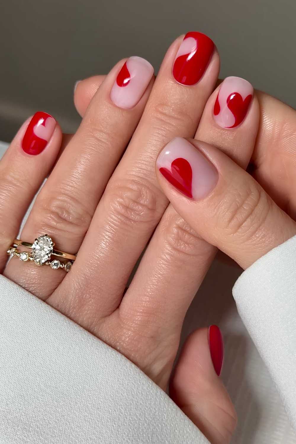 Short red nails with negative space hearts