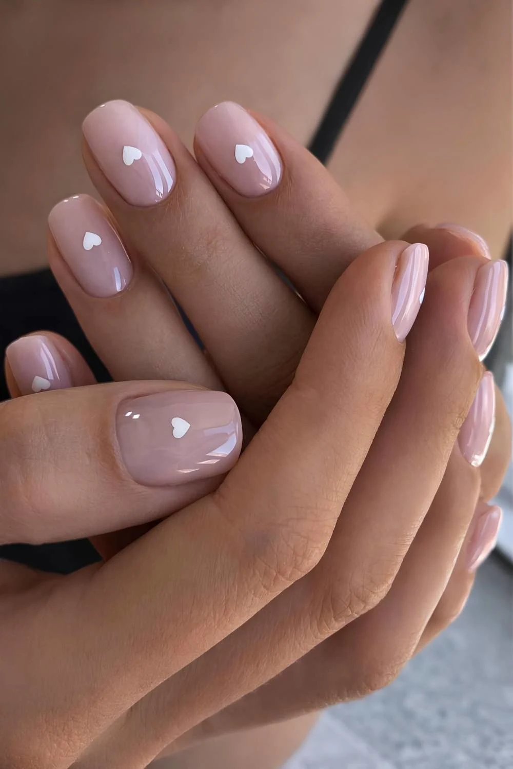Short sheer nails with white hearts