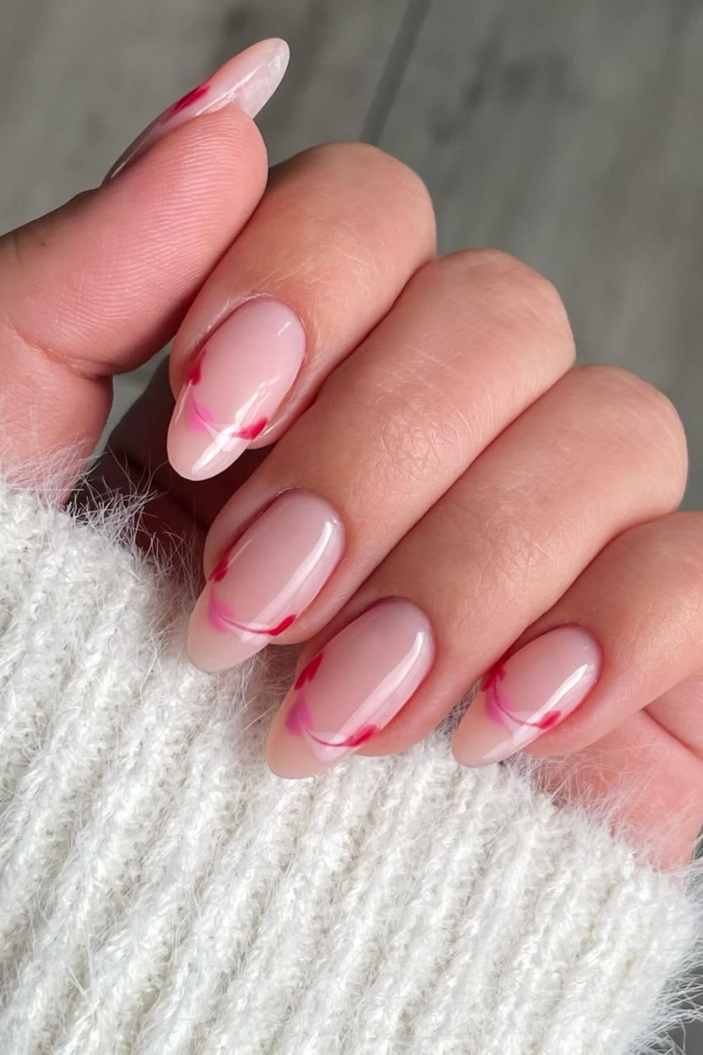 Soft pink nails with faded heart outline