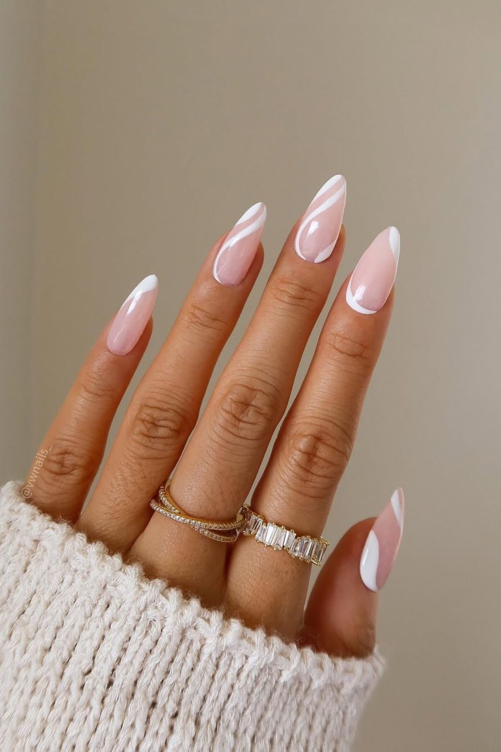 Soft pink nails with white swirls