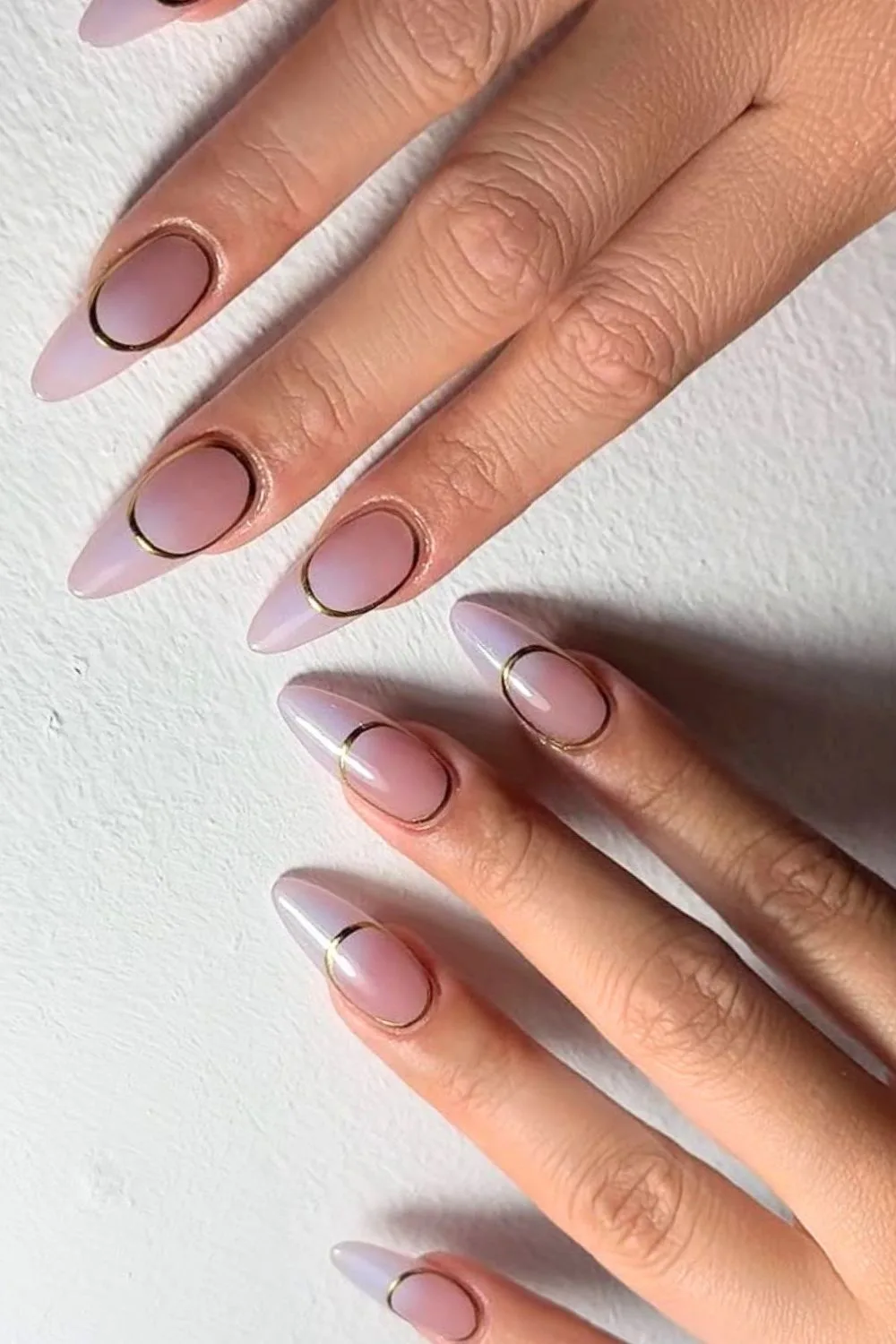 Soft purple ombre nails with gold chrome ring accents