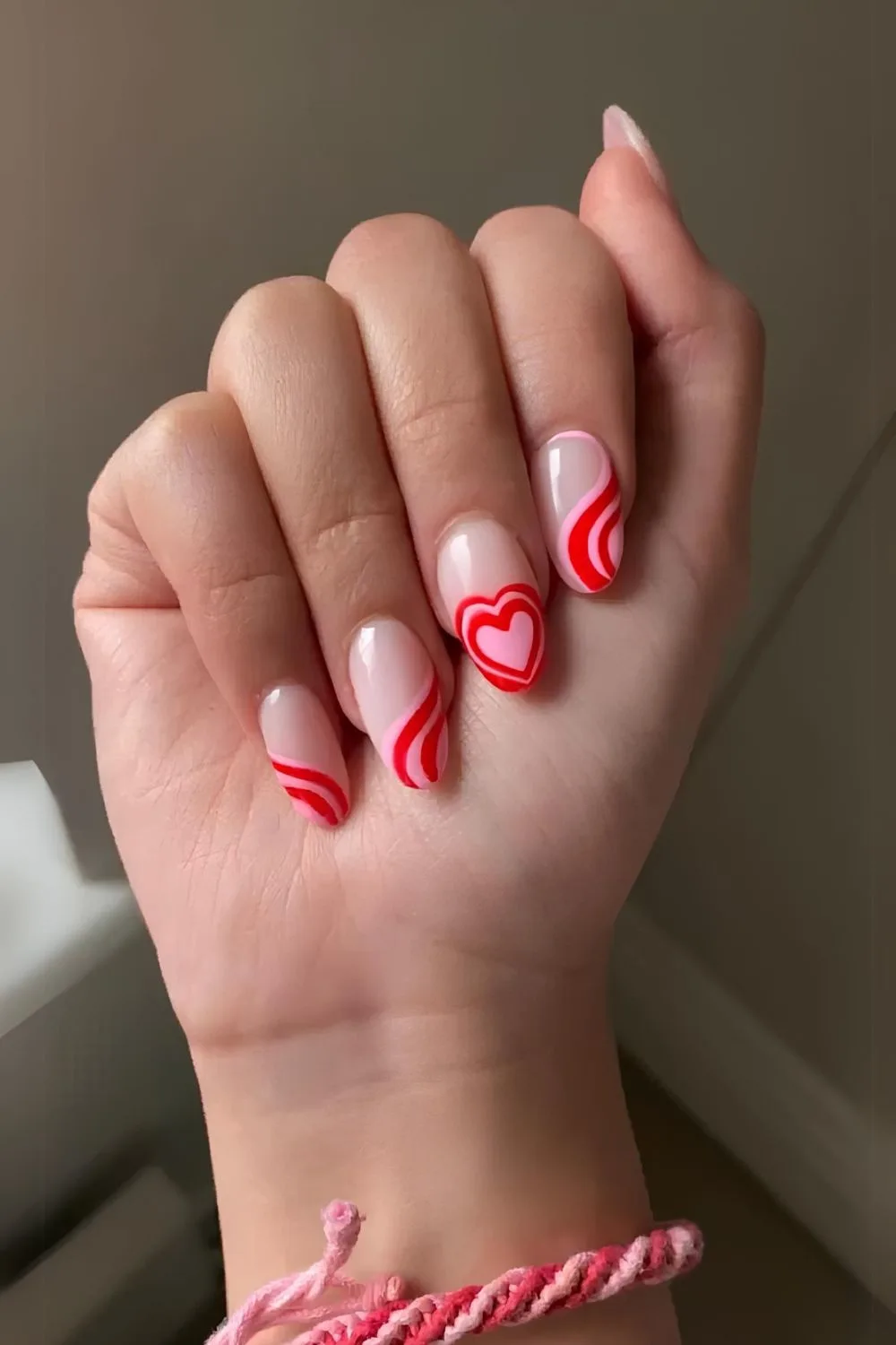 Swirly pink and red Valentine nails