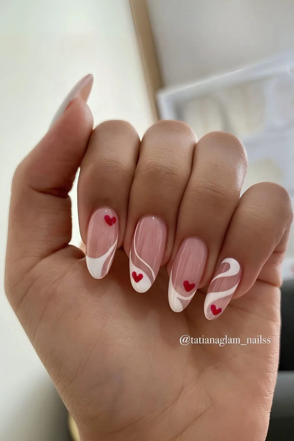 Swirly white French nails with hearts