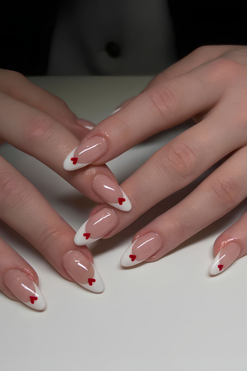 White French mani with tiny red hearts