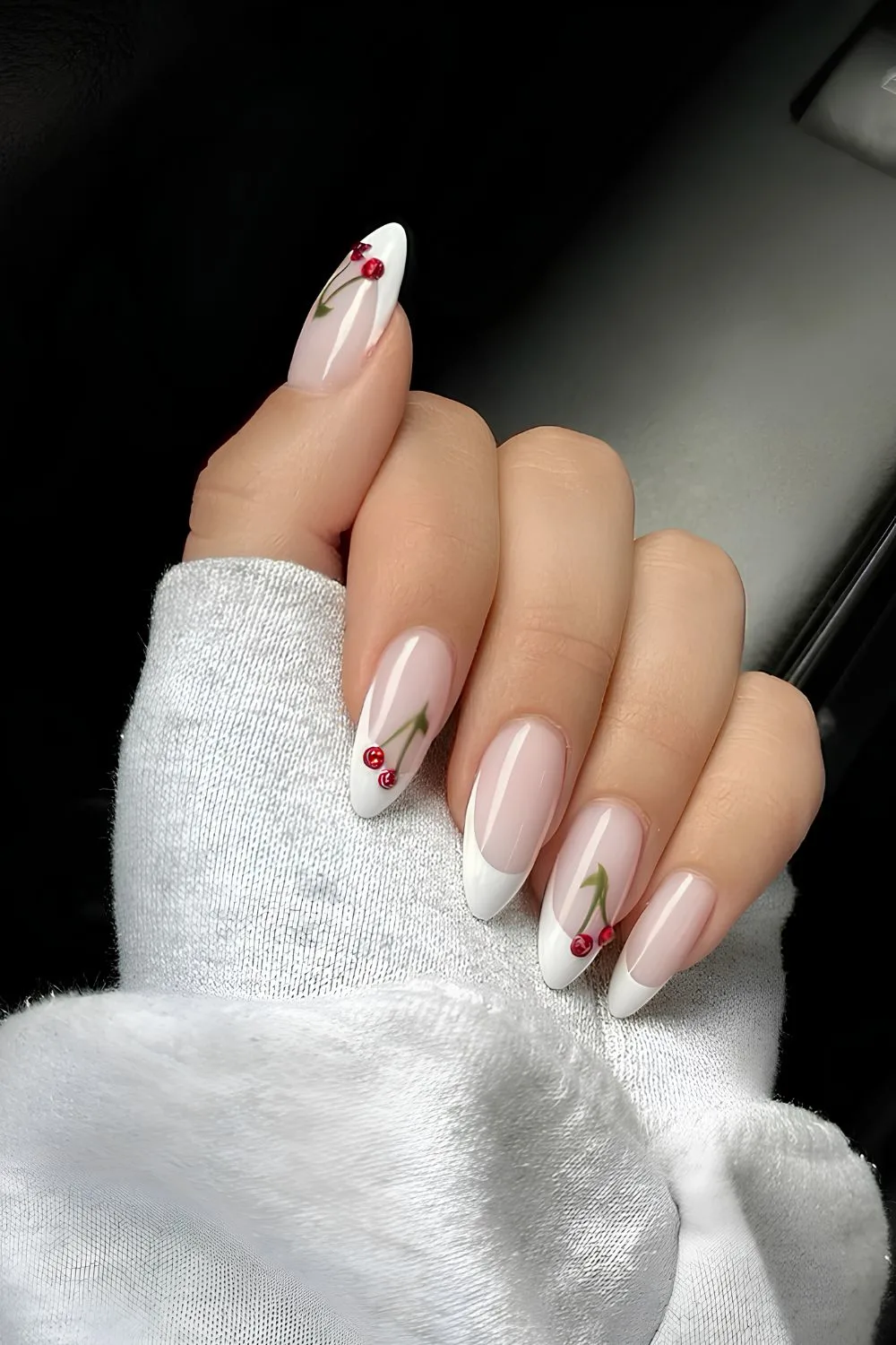 White French nails with cherry accents