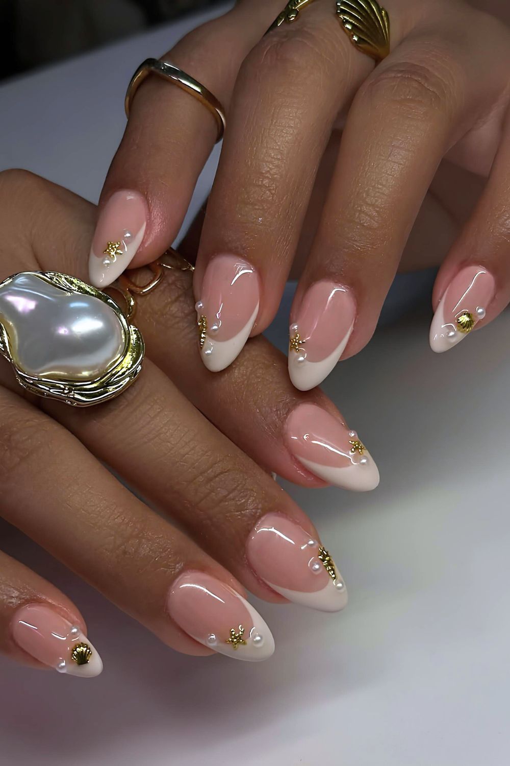 White French nails with pearls and seashells