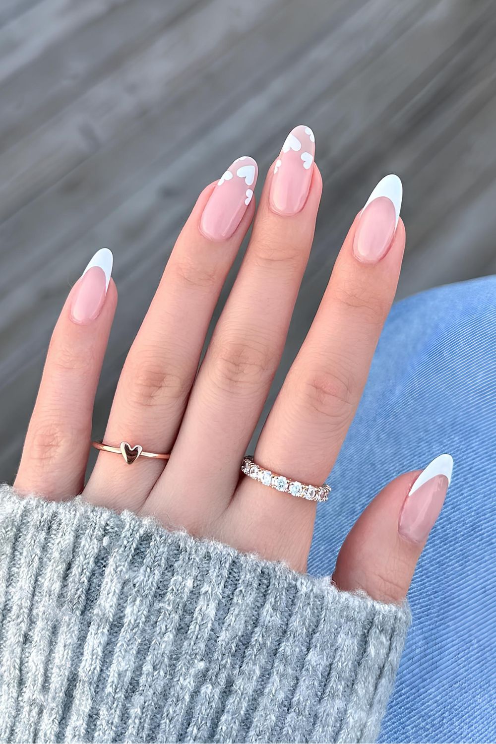 White French nails with tiny hearts