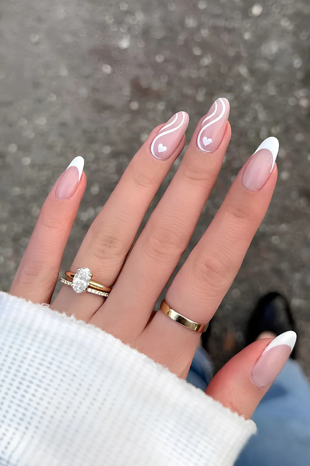 White French tip mani with hearts and swirls