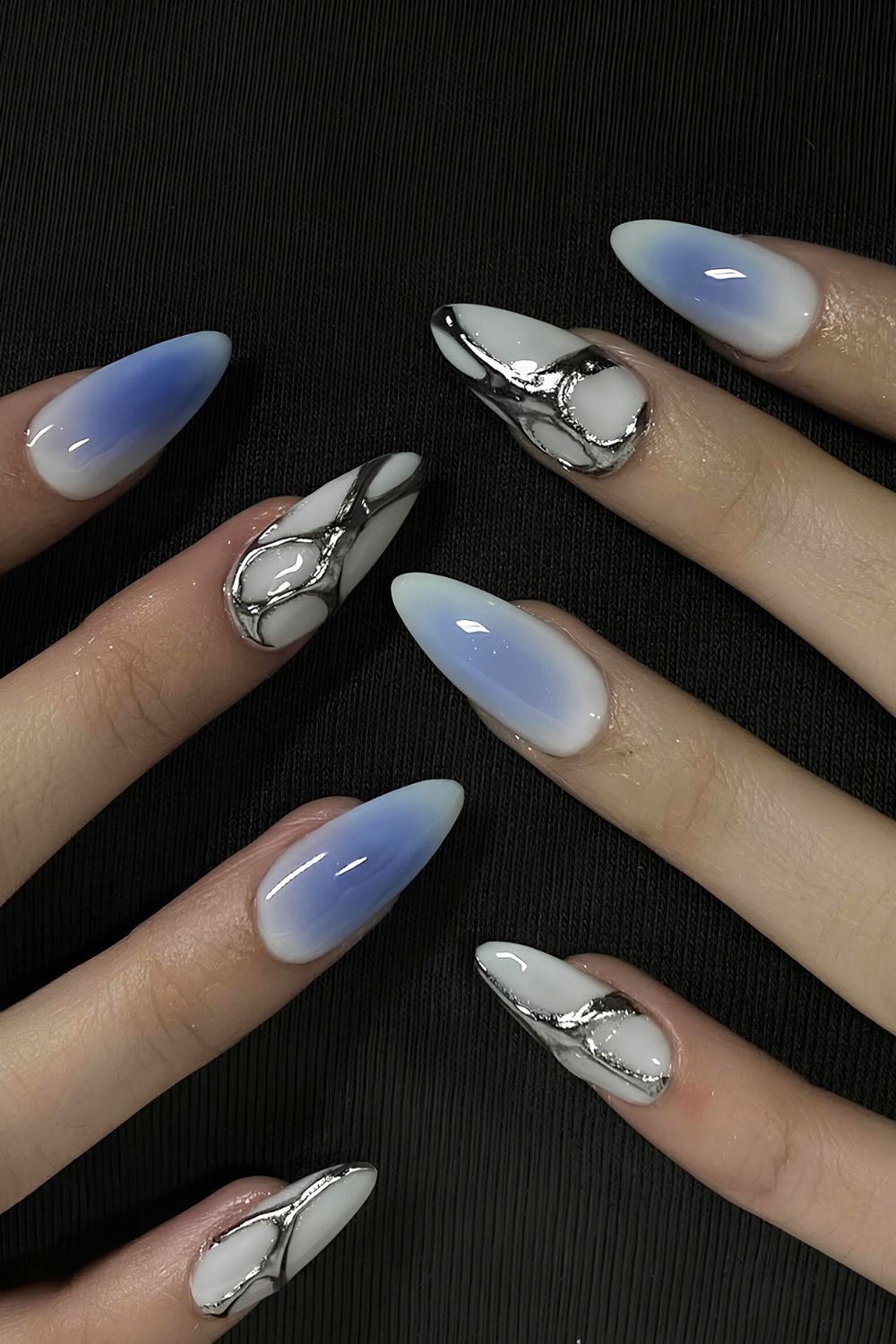 White and blue aura nails with silver accents