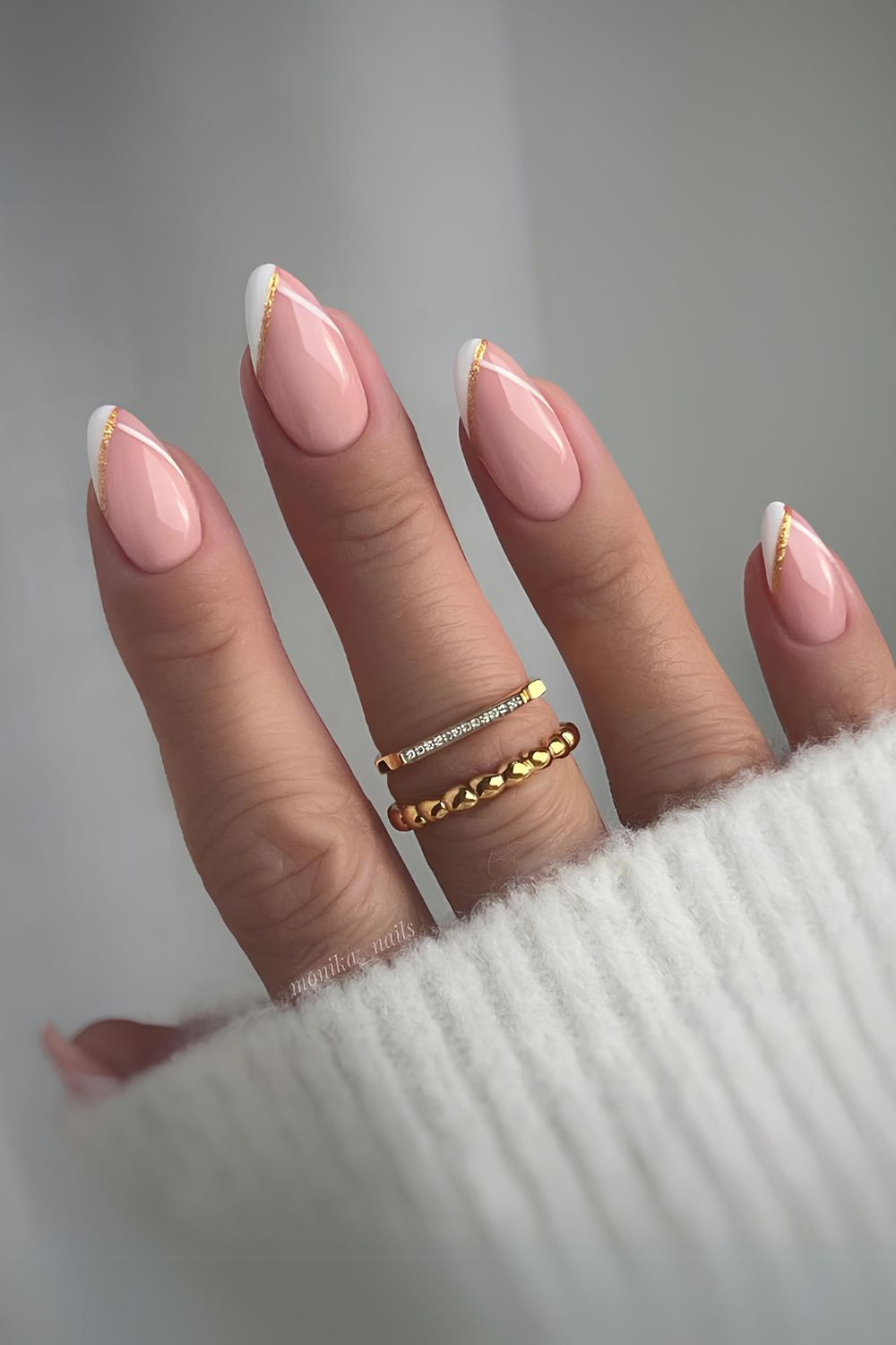 White and gold pointed French tip mani