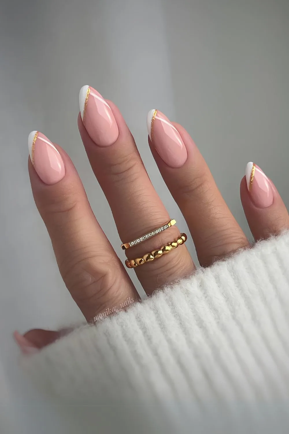 White and gold pointed French tip mani