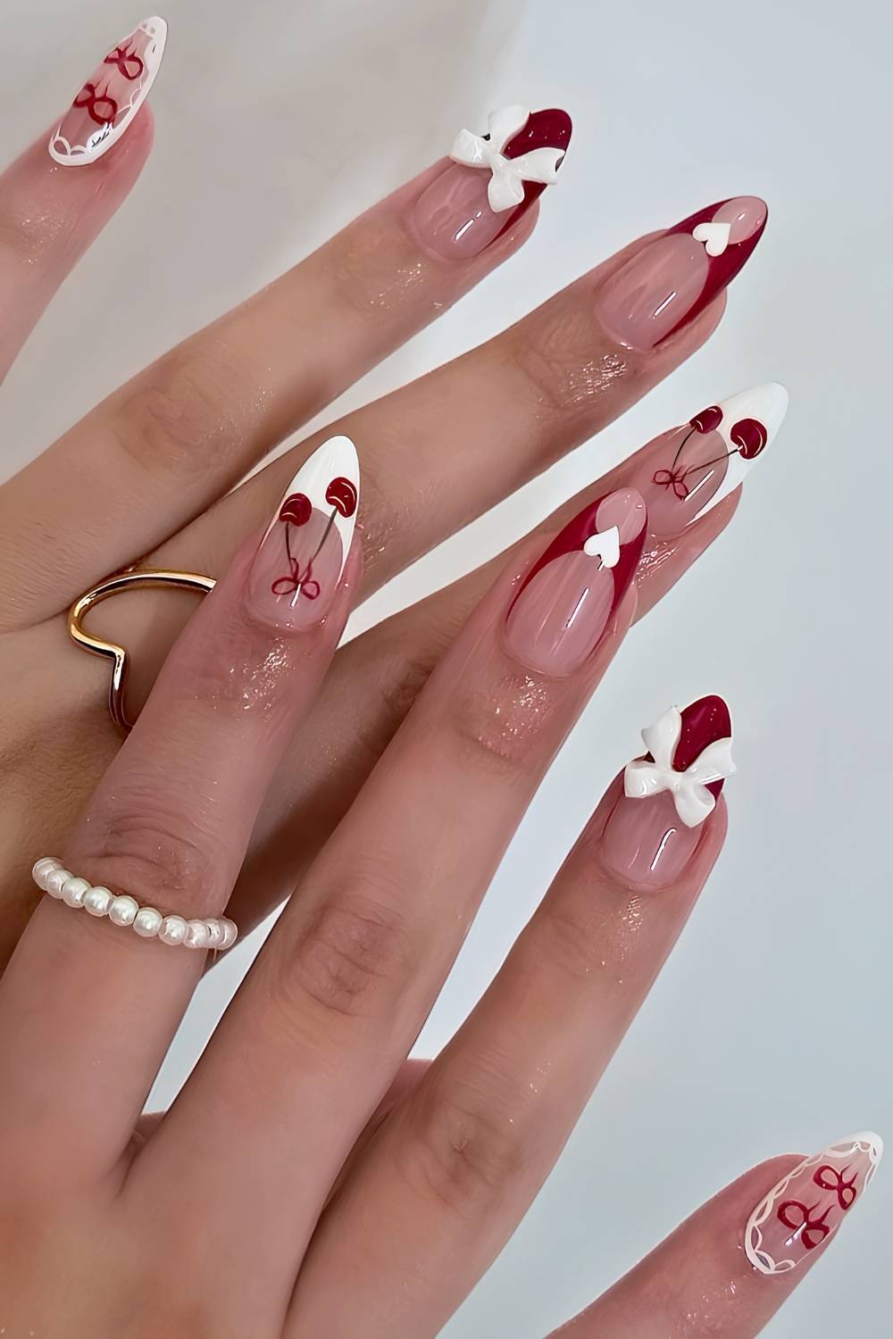 White and red French nails with cherries and hearts