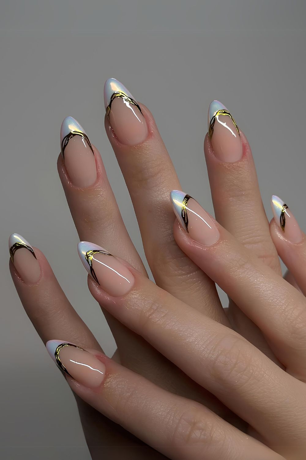 White chrome French nails with gold accents