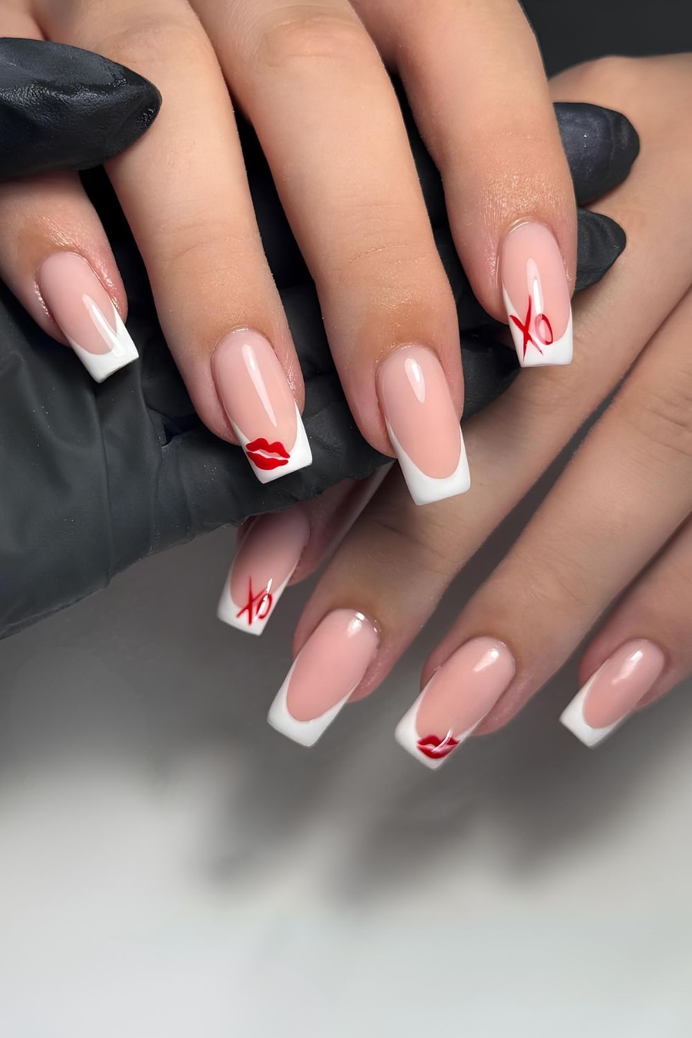 White french tips with red lip print and xo accents