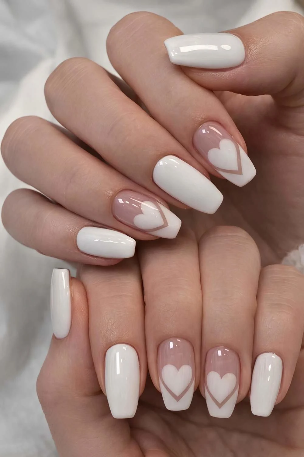 White mani with hearts and accent French tips