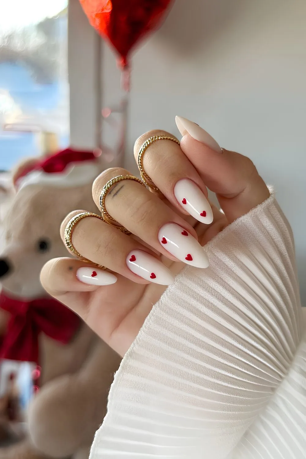 White mani with red hearts