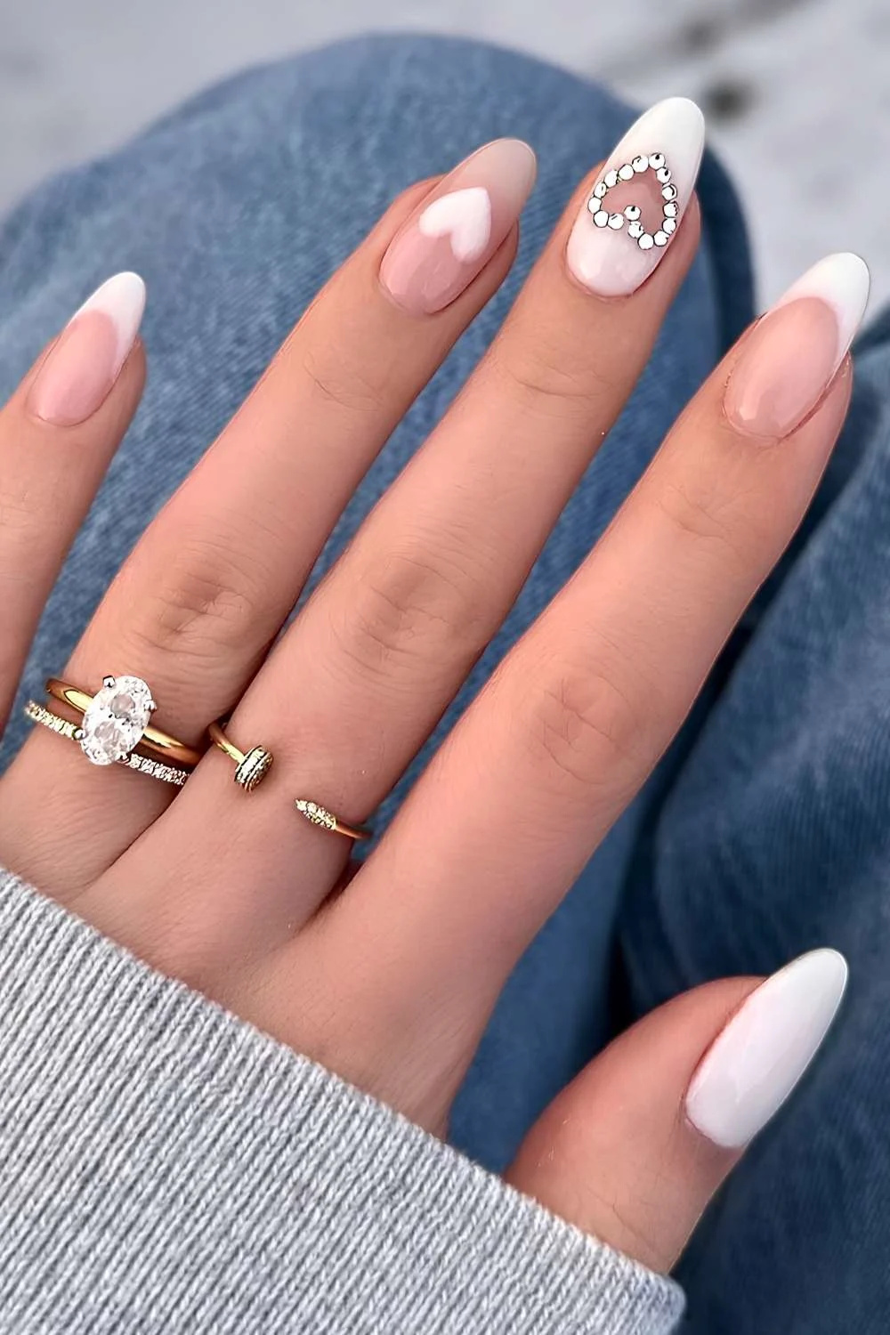 White manicure with hearts and gems