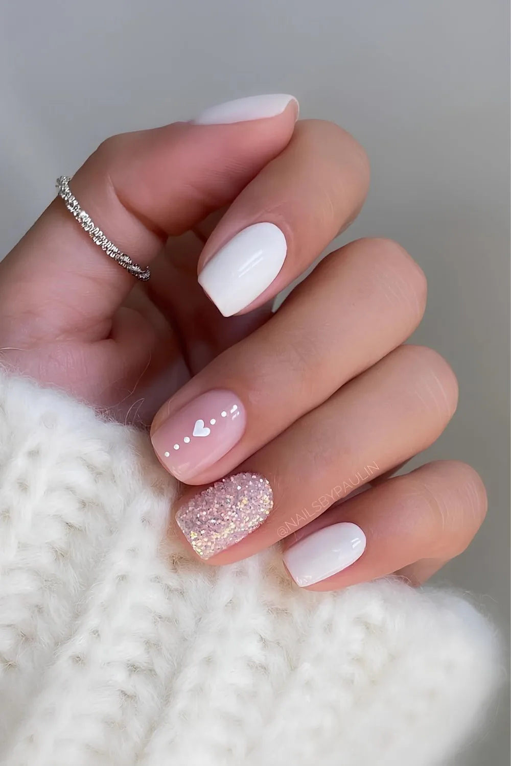 White nails with heart and glitter accent