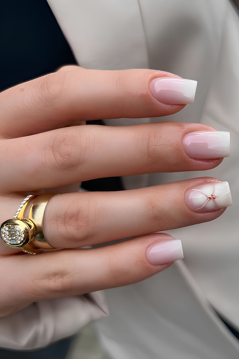 White ombre mani with blooming flower accent