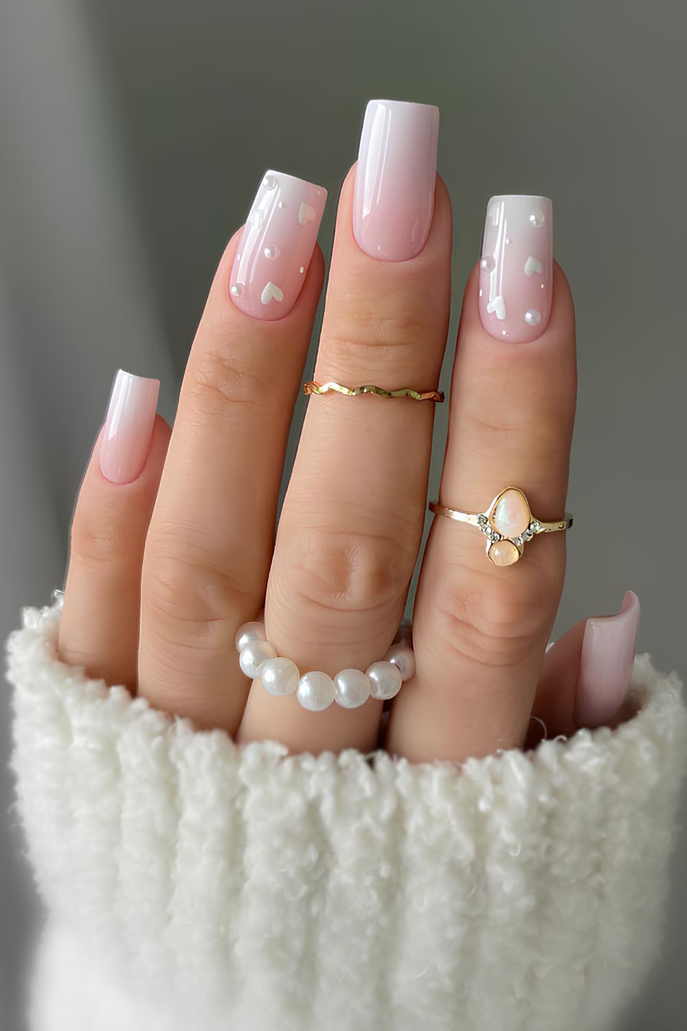 White ombre manicure with pearls and hearts