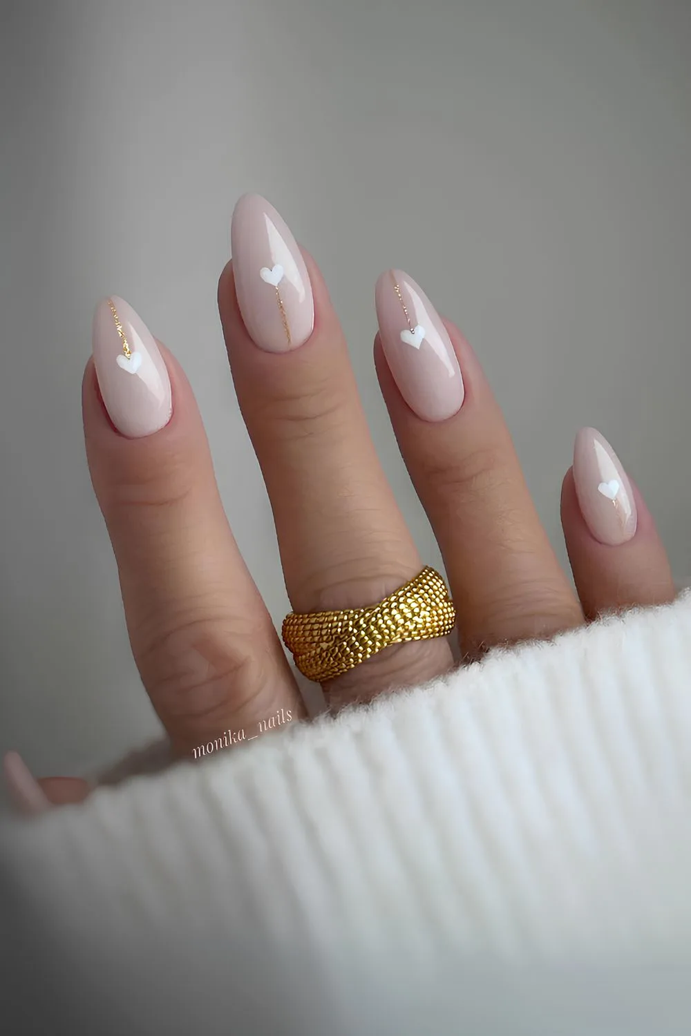 Neutral mani with glitter and heart accents