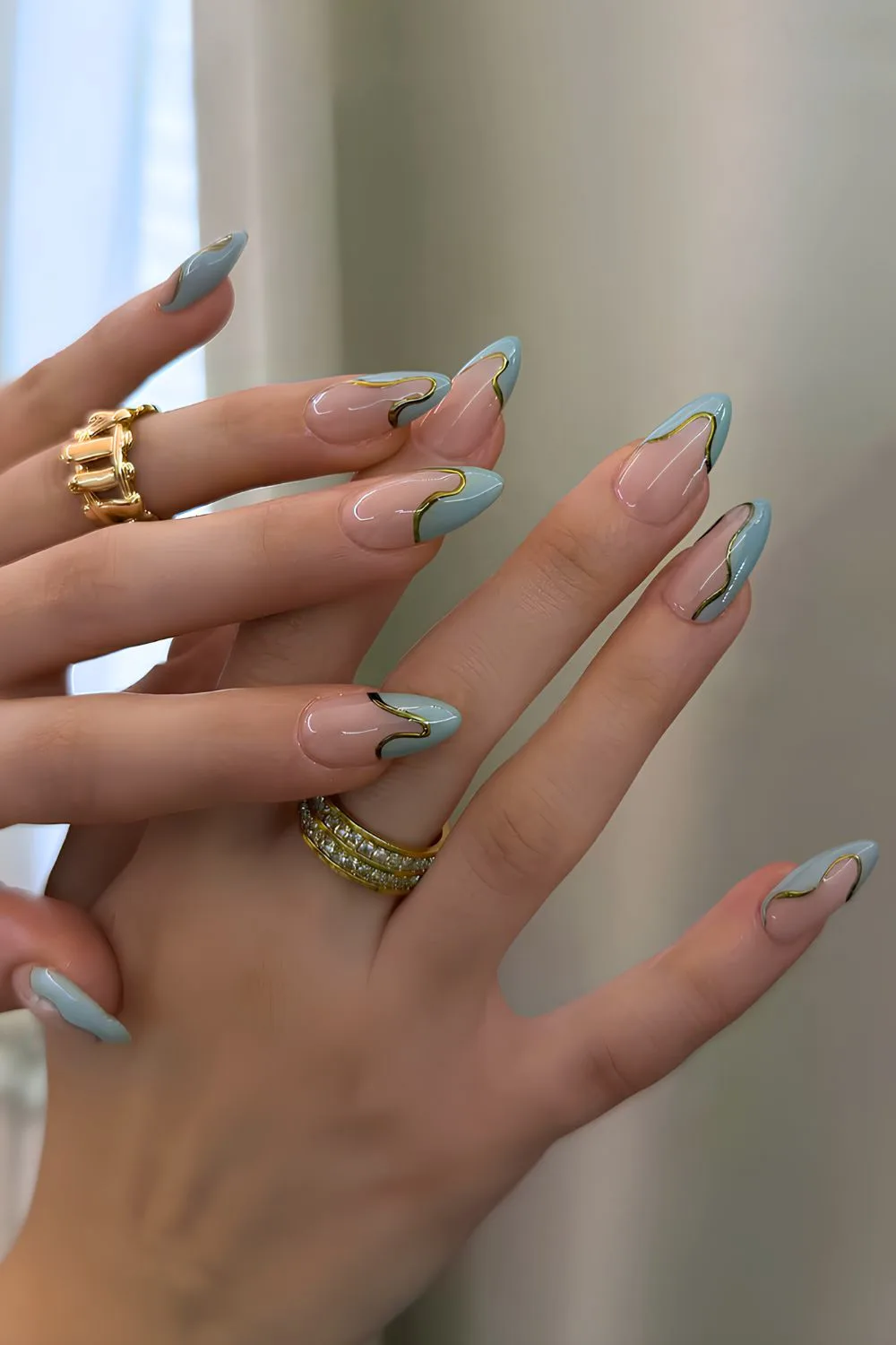 Abstract teal blue French nails with gold outline