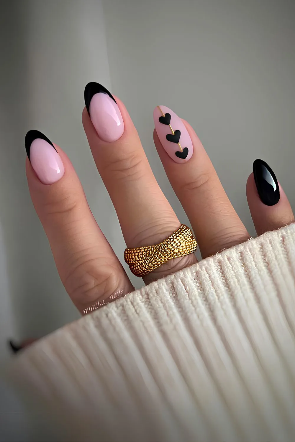 Black French nails with accent hearts