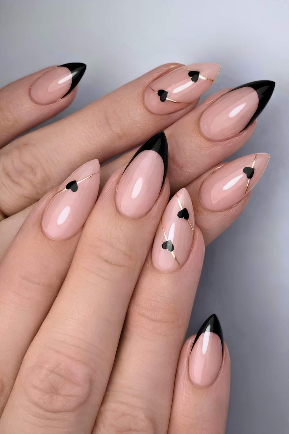 Black French nails with hearts and gold lines