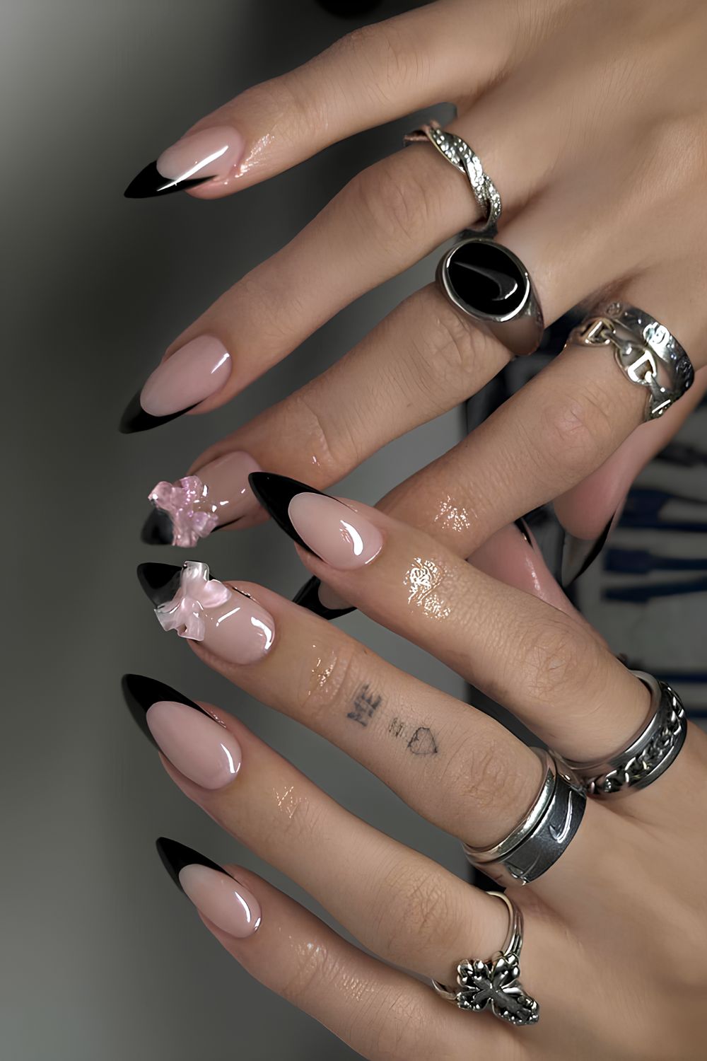 Black French nails with pink 3d bows