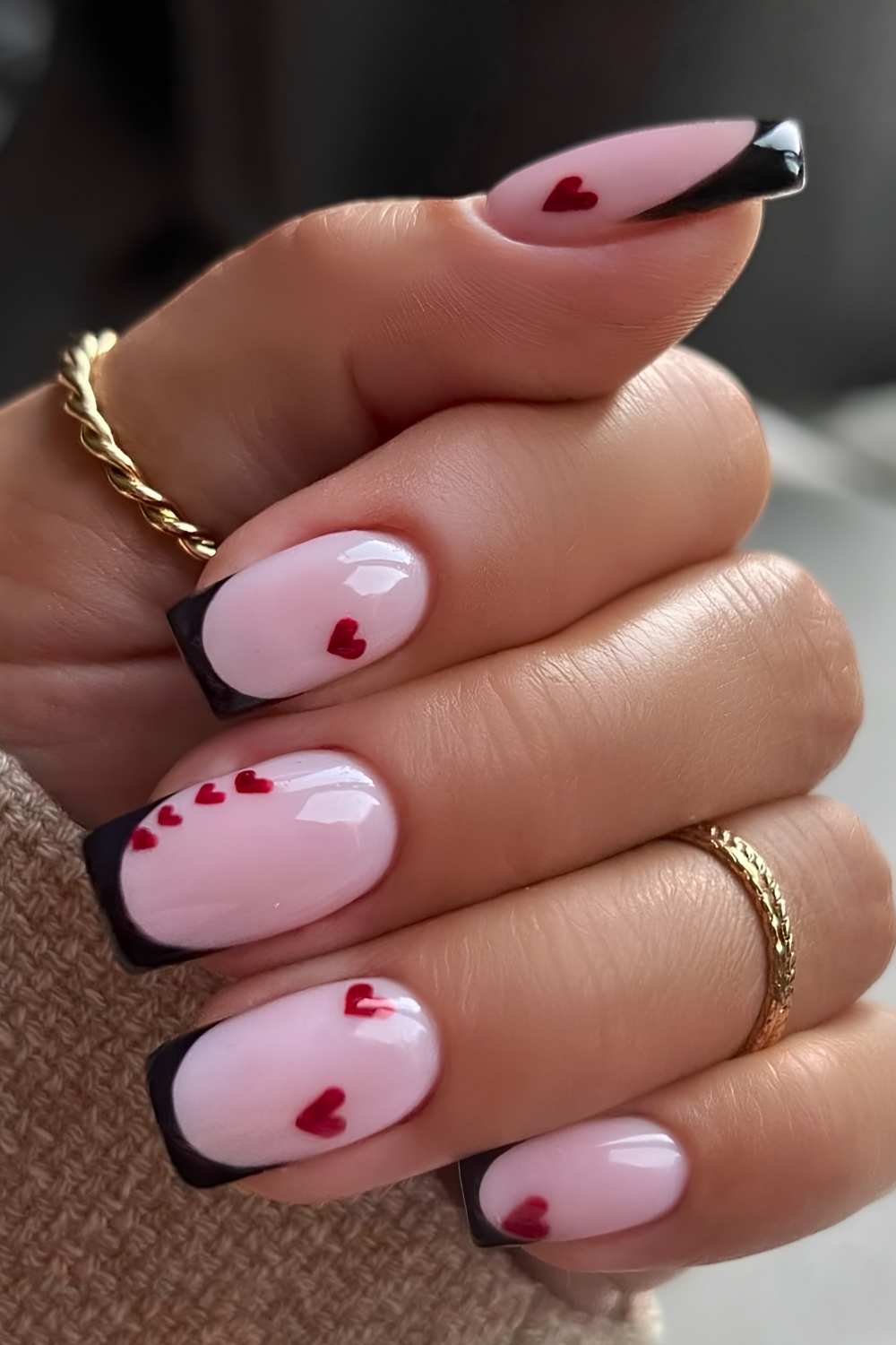 Black French tips with accent red hearts