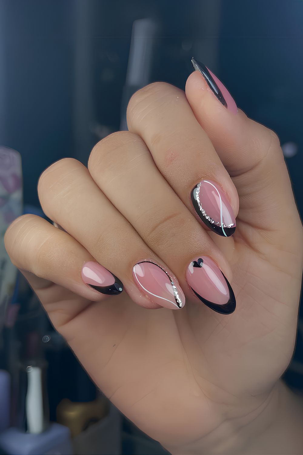 Black Valentine nails with glitter and swirls