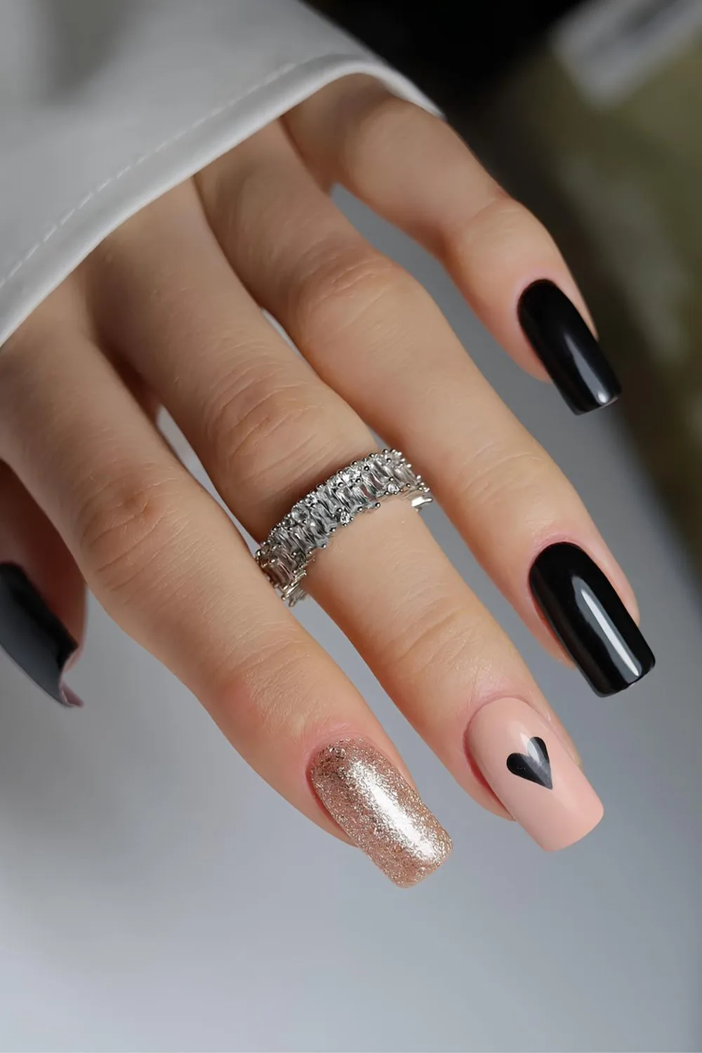 Black Valentine nails with gold accents