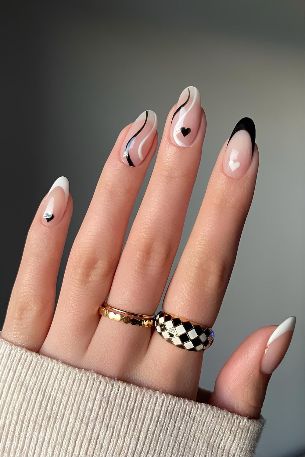 Black and white mani with swirls and hearts