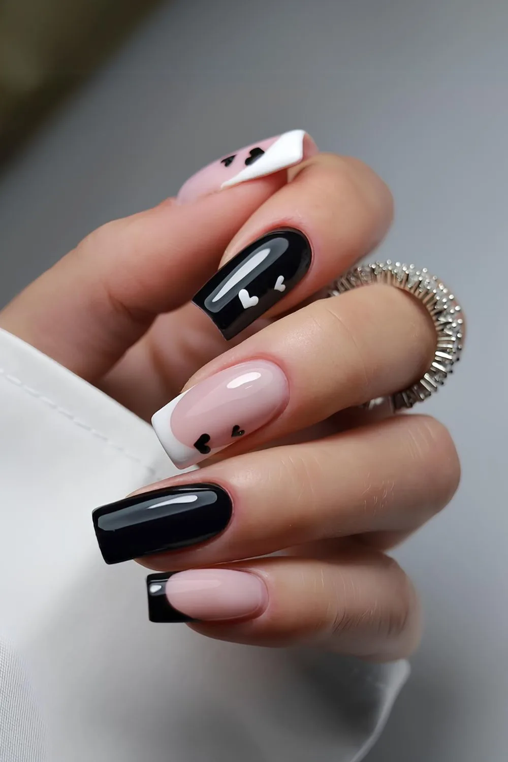 Black and white mani with tiny hearts