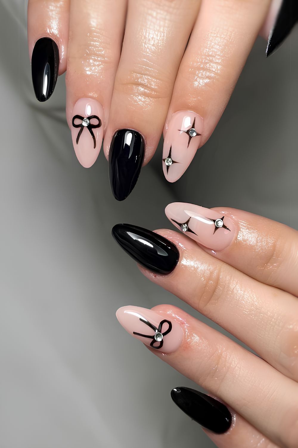 Black manicure with bows and stars